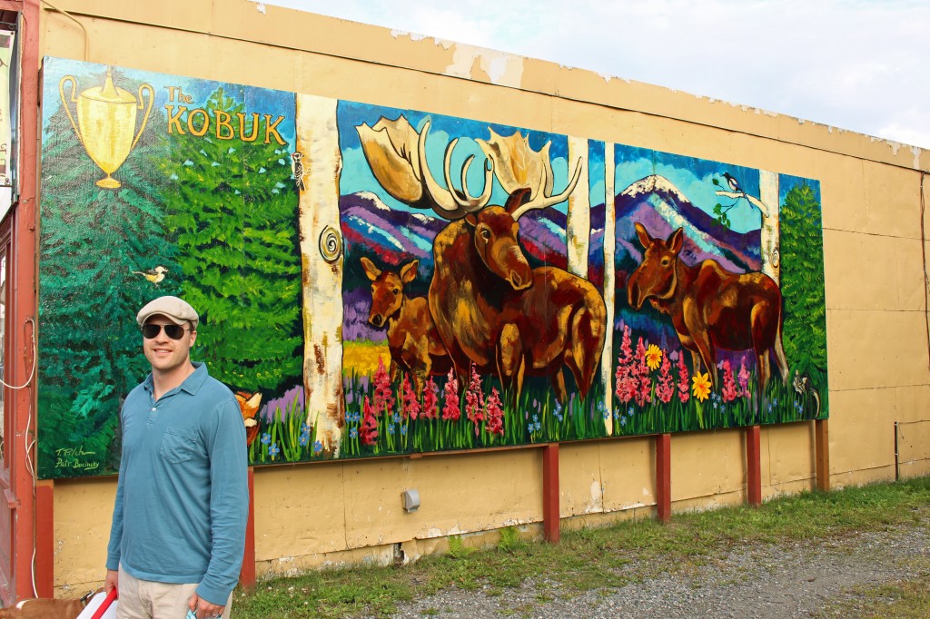 nate in front of moose painting